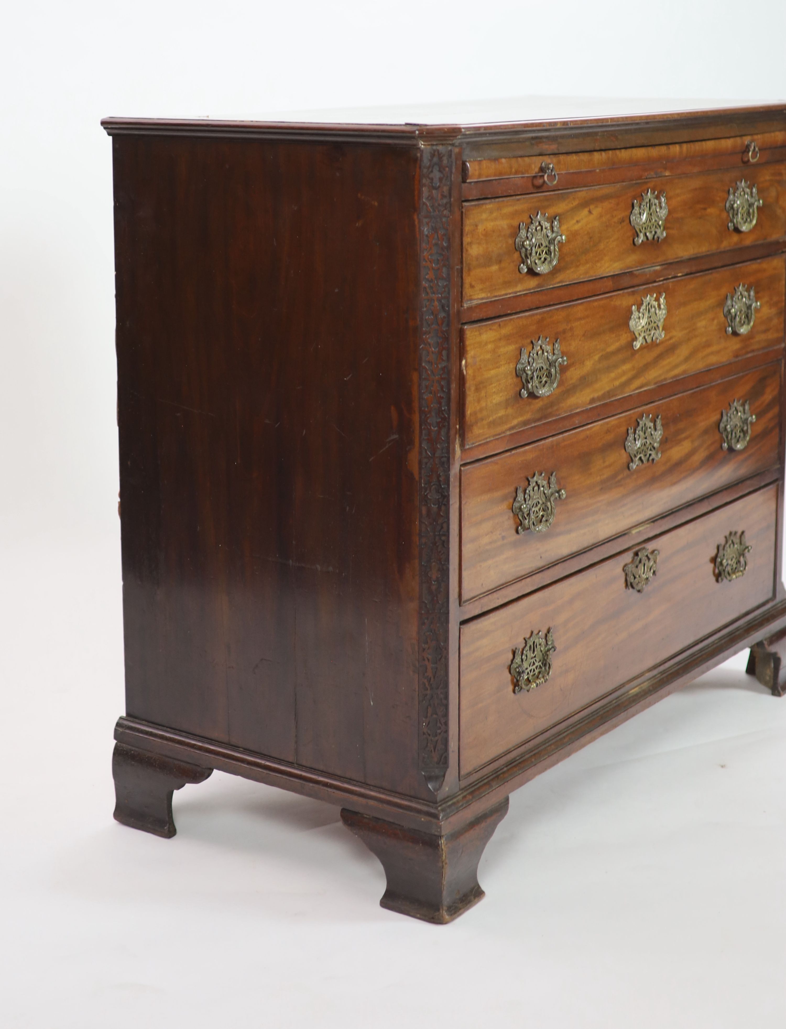 A George III mahogany four drawer chest of drawers with brushing slide, width 110cm, depth 54cm, height 98cm